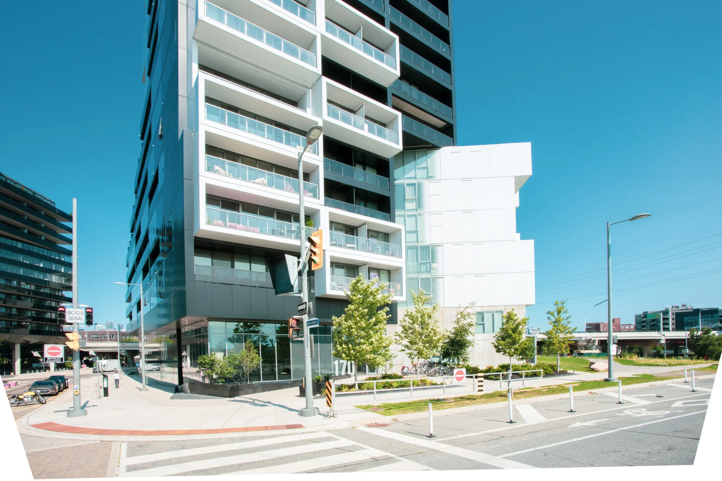 Street-level landscape wraps the contemporary condominium at 170 Bayview Avenue